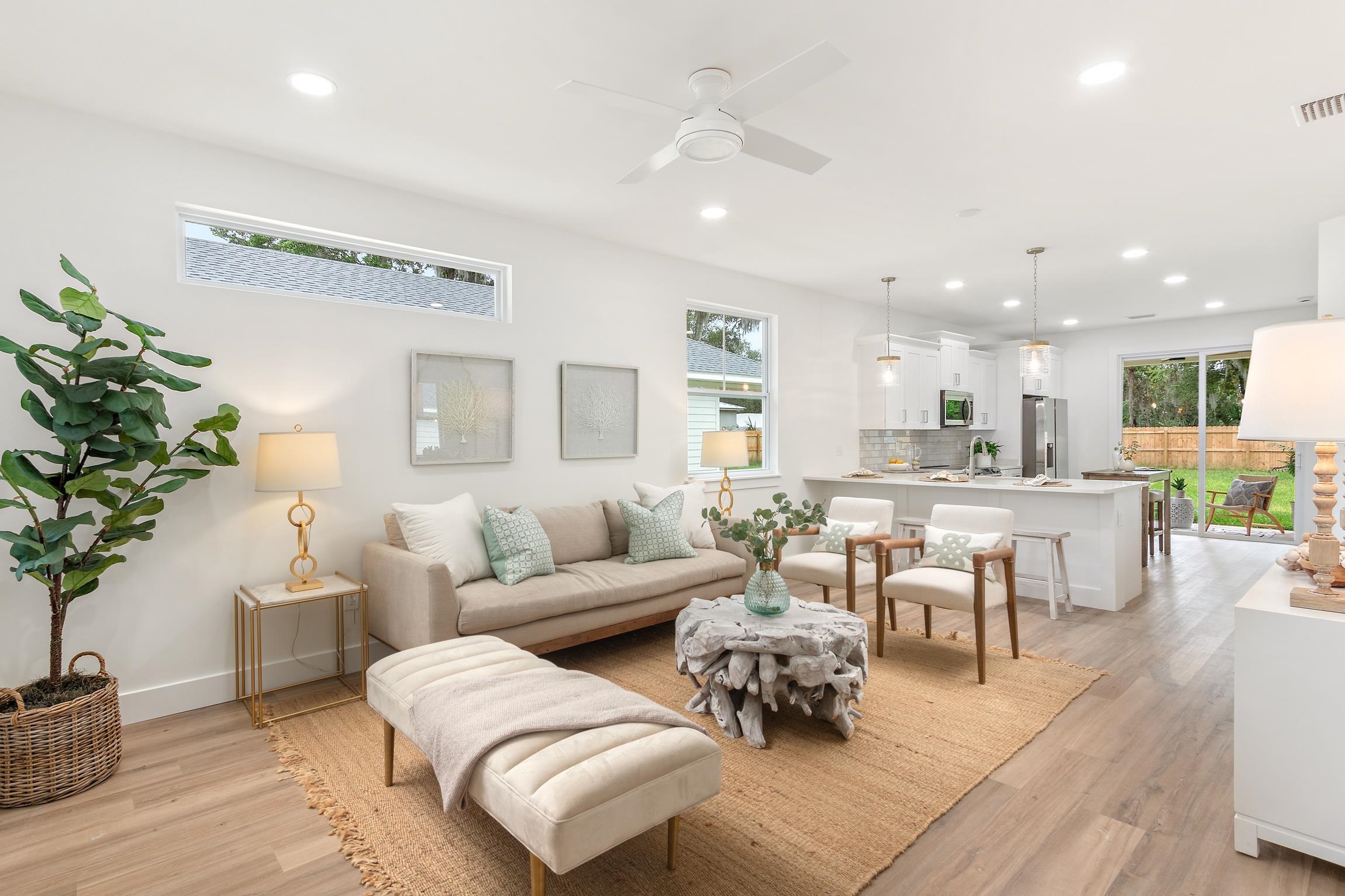 24 River Road St. Augustine, FL 32084 - Photo 5 of 26 a living room with furniture potted plant and kitchen view
