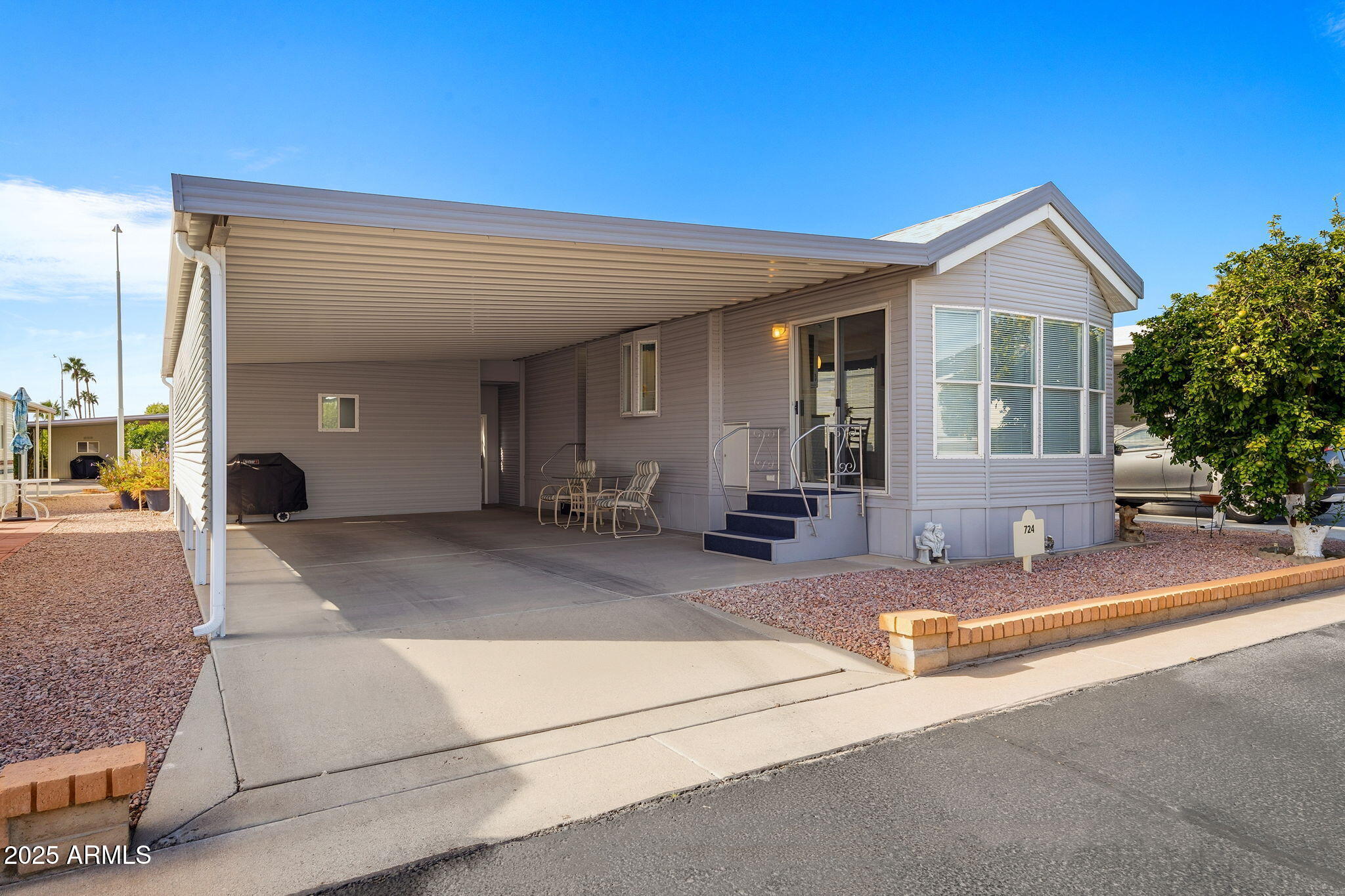 111 South Greenfield Road, Unit 724 Mesa, AZ 85206 - Photo 1 of 23 a view of a house with outdoor space and a car parked