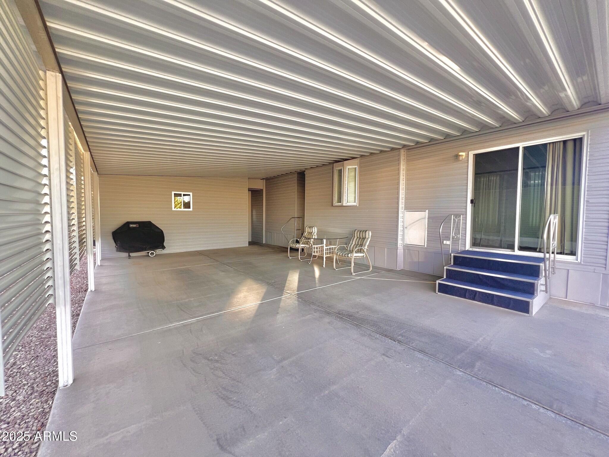111 South Greenfield Road, Unit 724 Mesa, AZ 85206 - Photo 12 of 23 a lobby with furniture and a potted plant