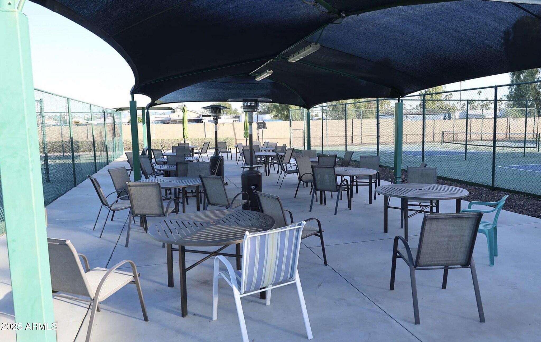 111 South Greenfield Road, Unit 724 Mesa, AZ 85206 - Photo 19 of 23 a view of a dining room with furniture window and outside view