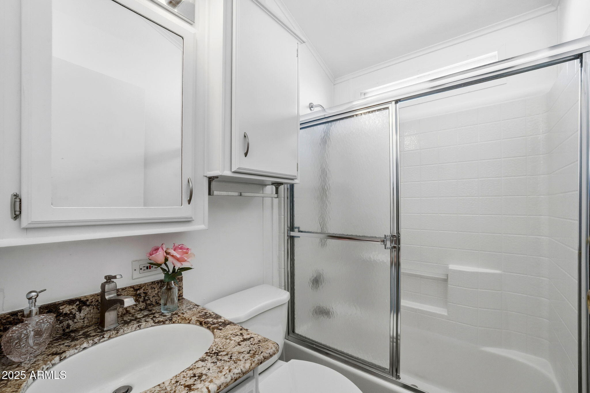 111 South Greenfield Road, Unit 724 Mesa, AZ 85206 - Photo 8 of 23 a bathroom with a sink and a mirror