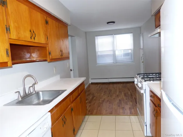 a kitchen with a sink and a microwave
