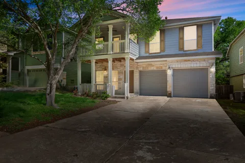 front view of a house with a garden