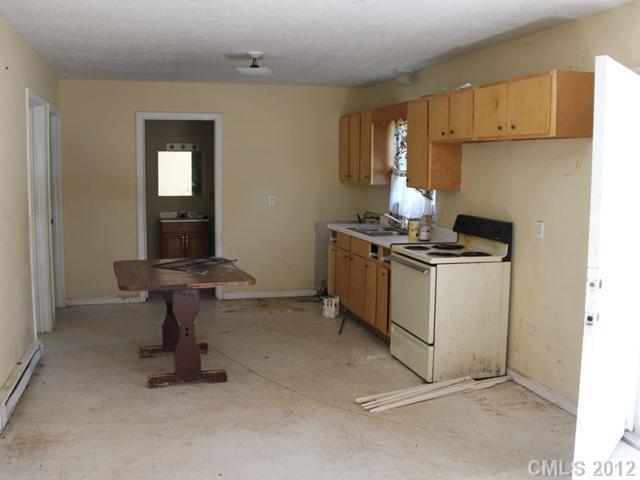 1-2 Cason Oldfield Road Morven, NC 28119 - Photo 4 of 12 a kitchen with a stove and a cabinet