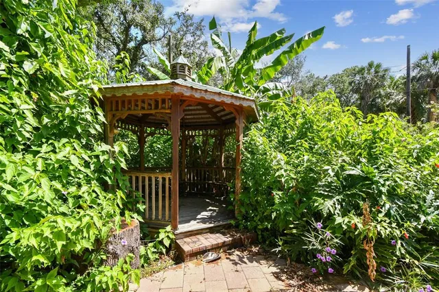 a view of stairs and a tree