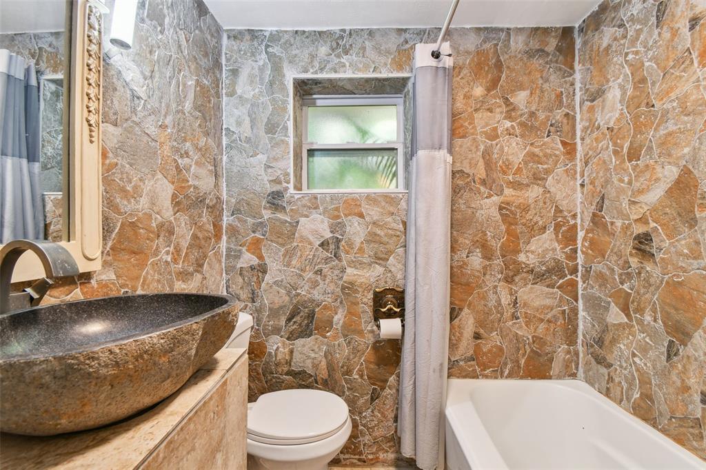 5909 Mohr Road Tampa, FL 33615 - Photo 37 of 48 a bathroom with a sink toilet and shower