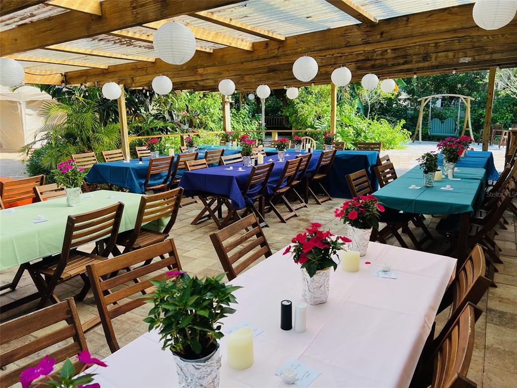 5909 Mohr Road Tampa, FL 33615 - Photo 4 of 48 a view of a patio with a table chairs and a potted plant