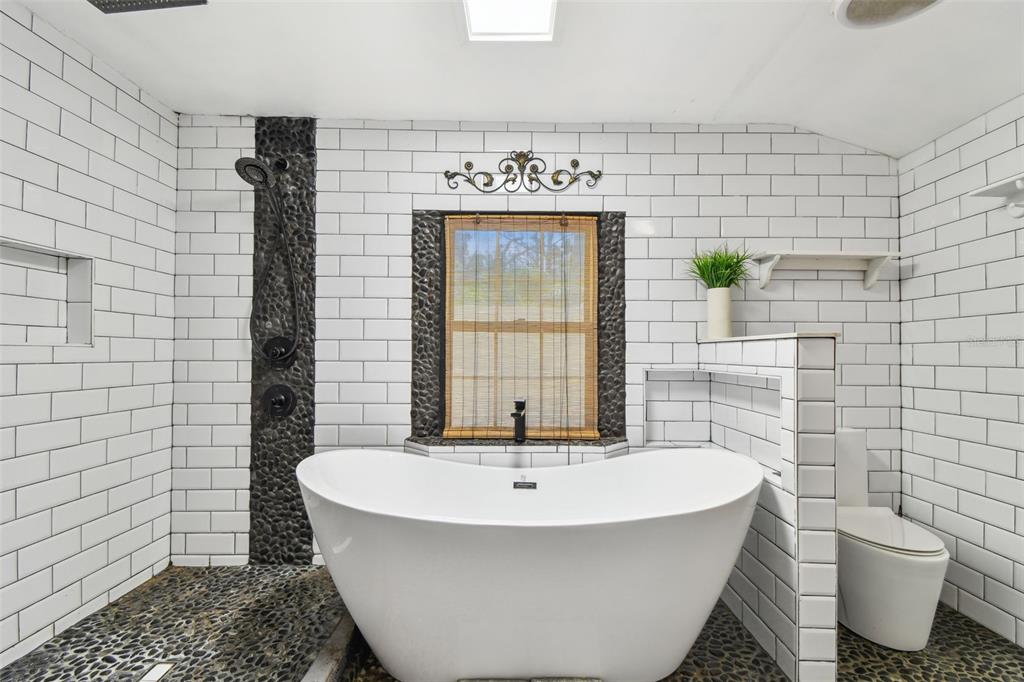 5909 Mohr Road Tampa, FL 33615 - Photo 41 of 48 a bathroom with a bathtub and sink
