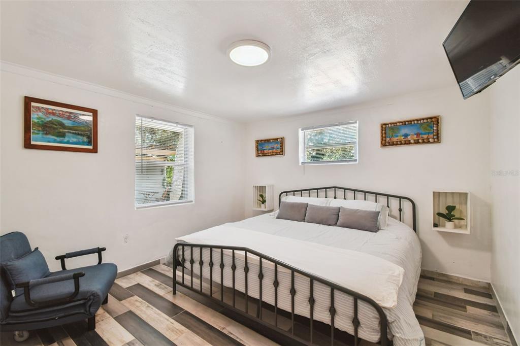 5909 Mohr Road Tampa, FL 33615 - Photo 42 of 48 a bedroom with a bed and a couch