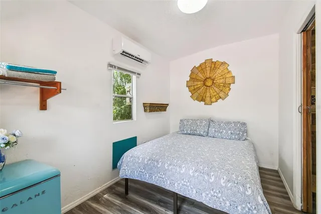 a bedroom with bed and window