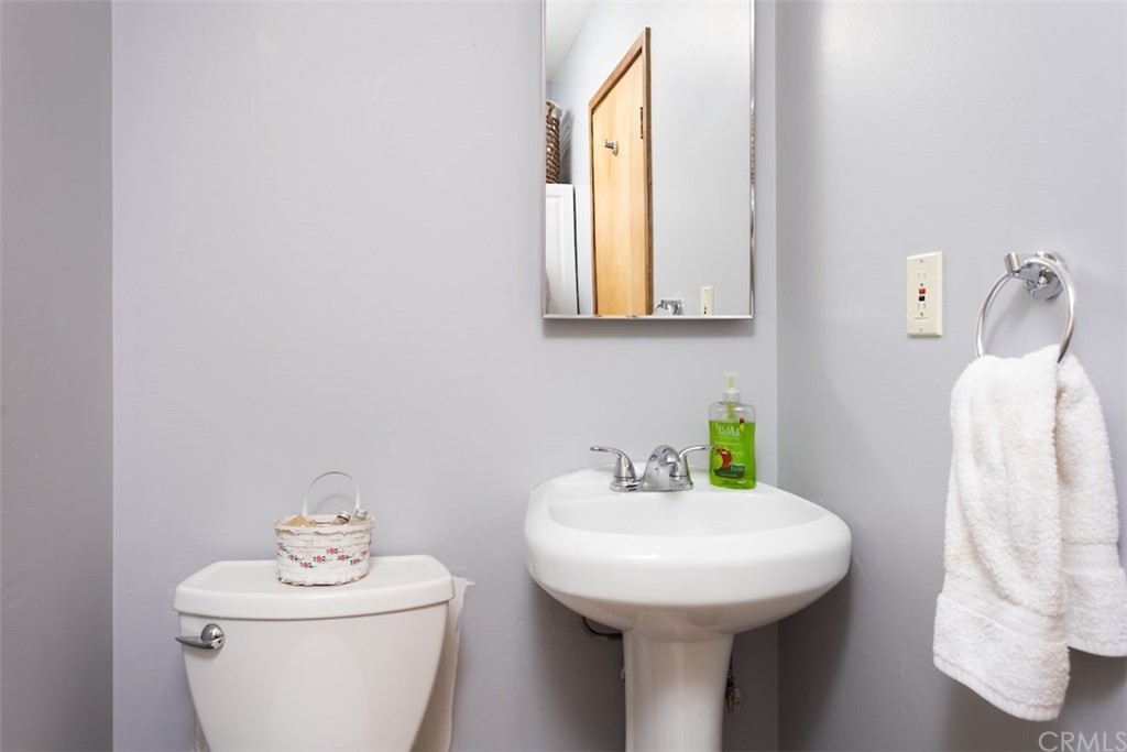 1270 Sheephorn Road Big Bear Lake, CA 92315 - Photo 12 of 25 a bathroom with a sink a toilet and a mirror
