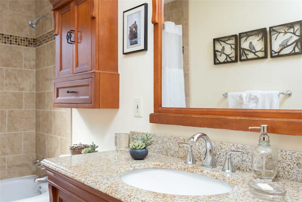 1270 Sheephorn Road Big Bear Lake, CA 92315 - Photo 15 of 25 a bathroom with a granite countertop sink and a mirror