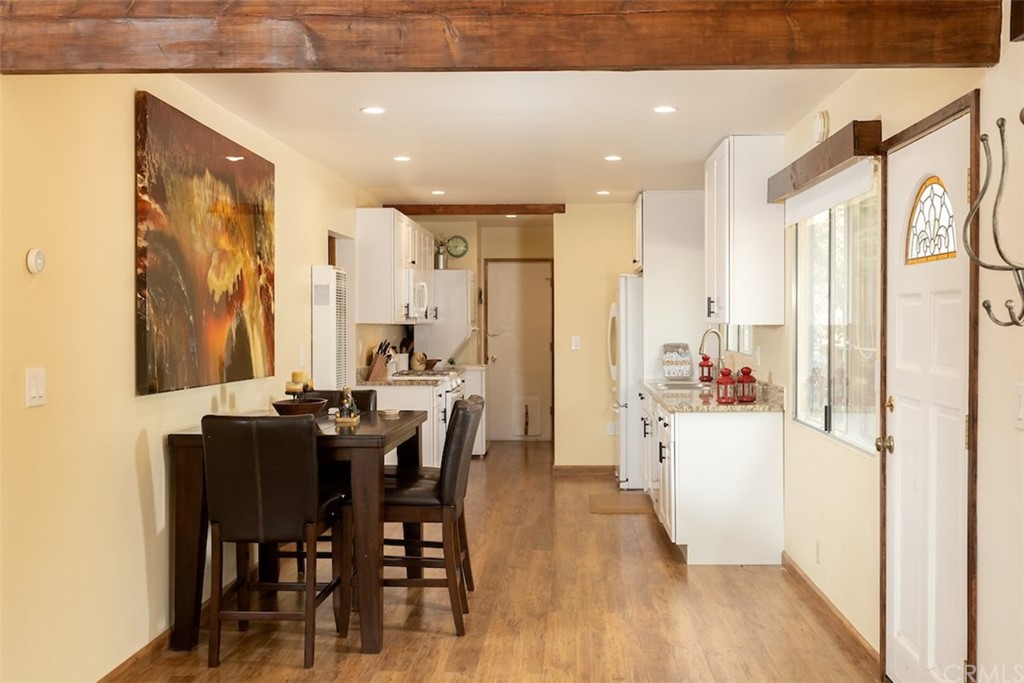 1270 Sheephorn Road Big Bear Lake, CA 92315 - Photo 5 of 25 a view of a a dining room with furniture window and wooden floor
