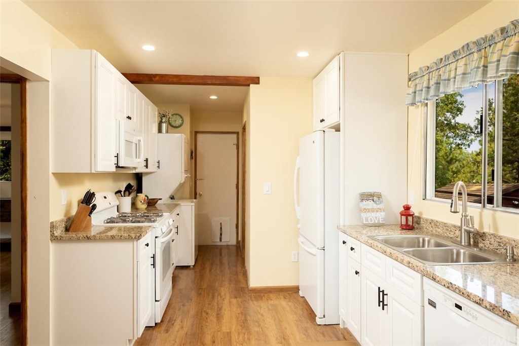 1270 Sheephorn Road Big Bear Lake, CA 92315 - Photo 8 of 25 a kitchen with sink refrigerator and window