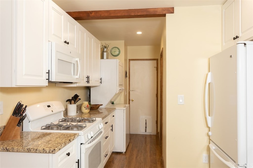 1270 Sheephorn Road Big Bear Lake, CA 92315 - Photo 10 of 25 a kitchen with white cabinets and refrigerator