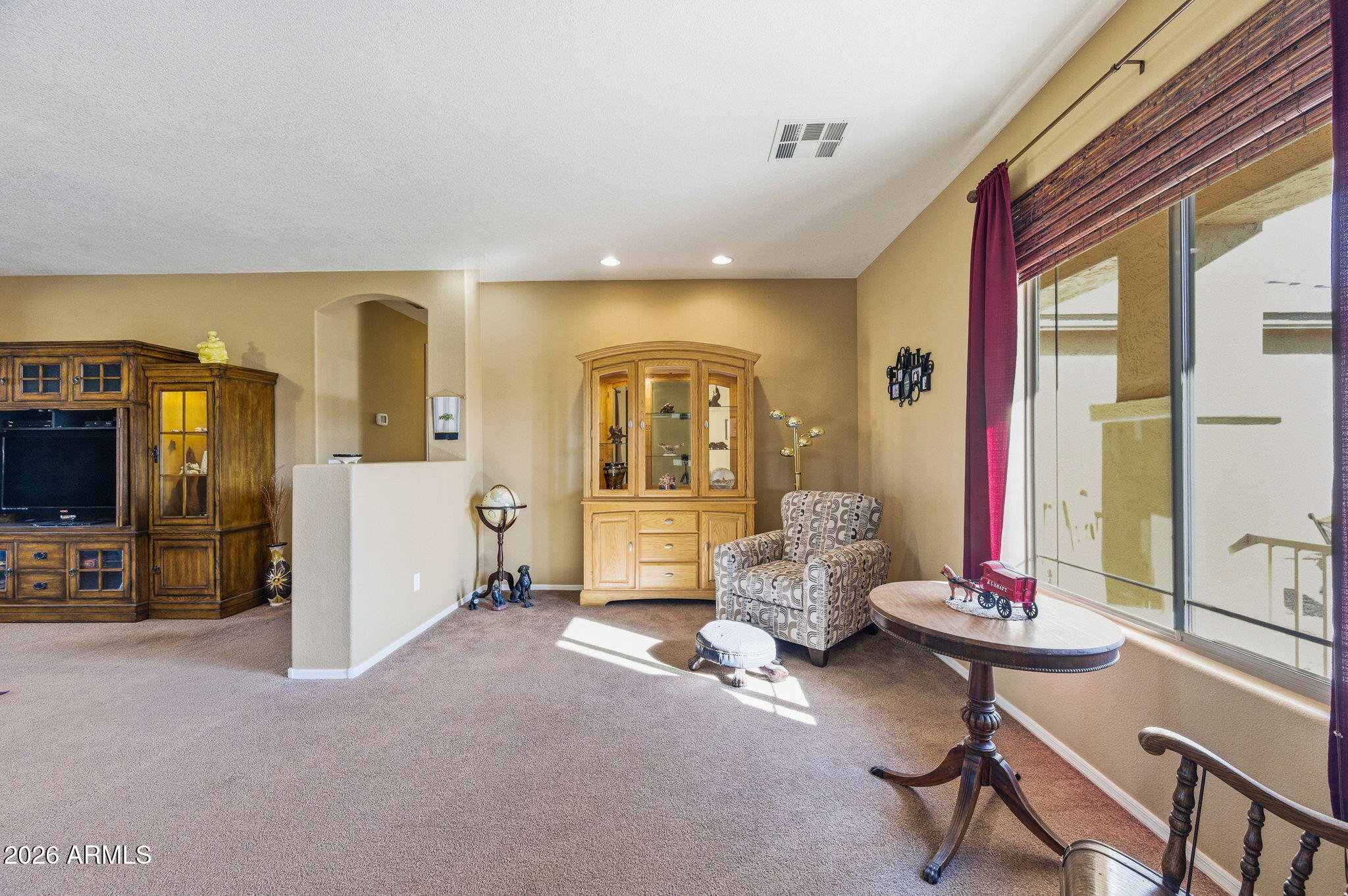 45558 West Mountain View Road Maricopa, AZ 85139 - Photo 14 of 33 a living room with furniture and a flat screen tv