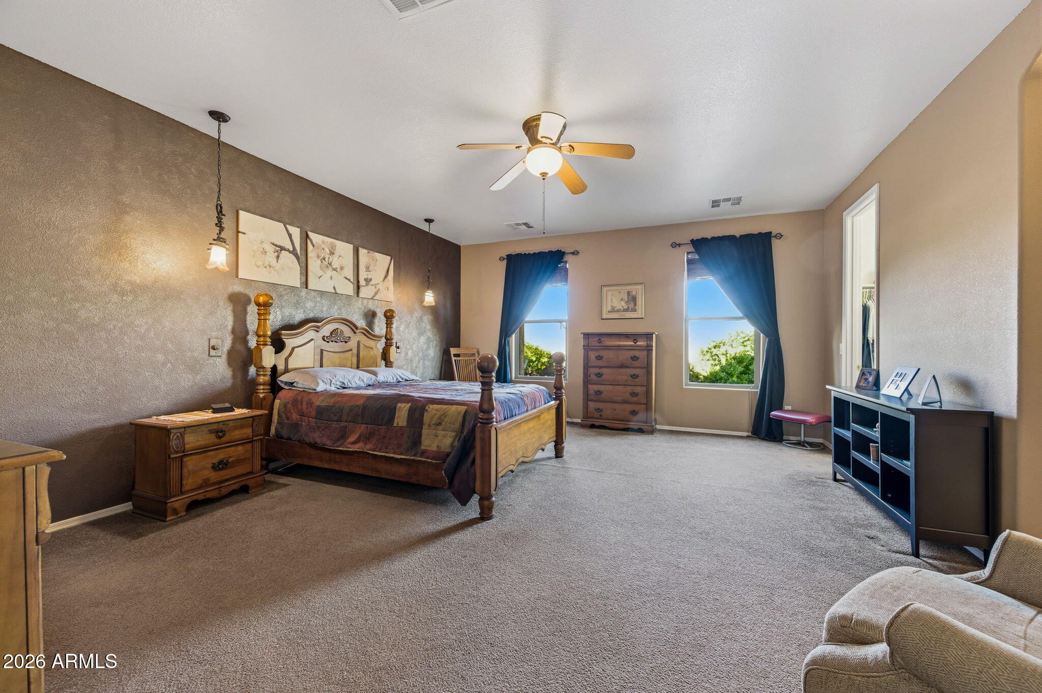 45558 West Mountain View Road Maricopa, AZ 85139 - Photo 15 of 33 a bedroom with furniture and a window