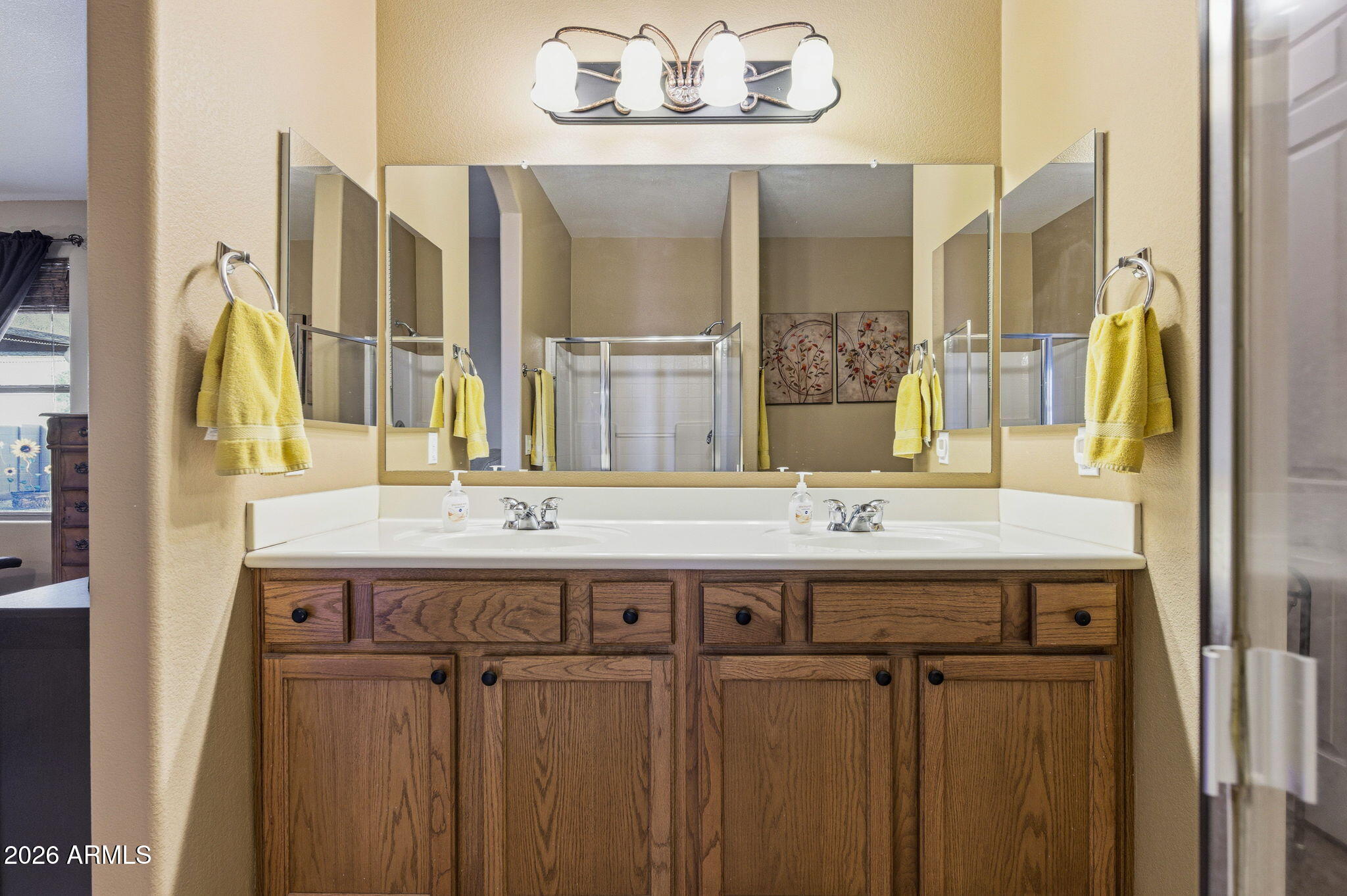45558 West Mountain View Road Maricopa, AZ 85139 - Photo 21 of 33 a bathroom with a granite countertop sink and a mirror
