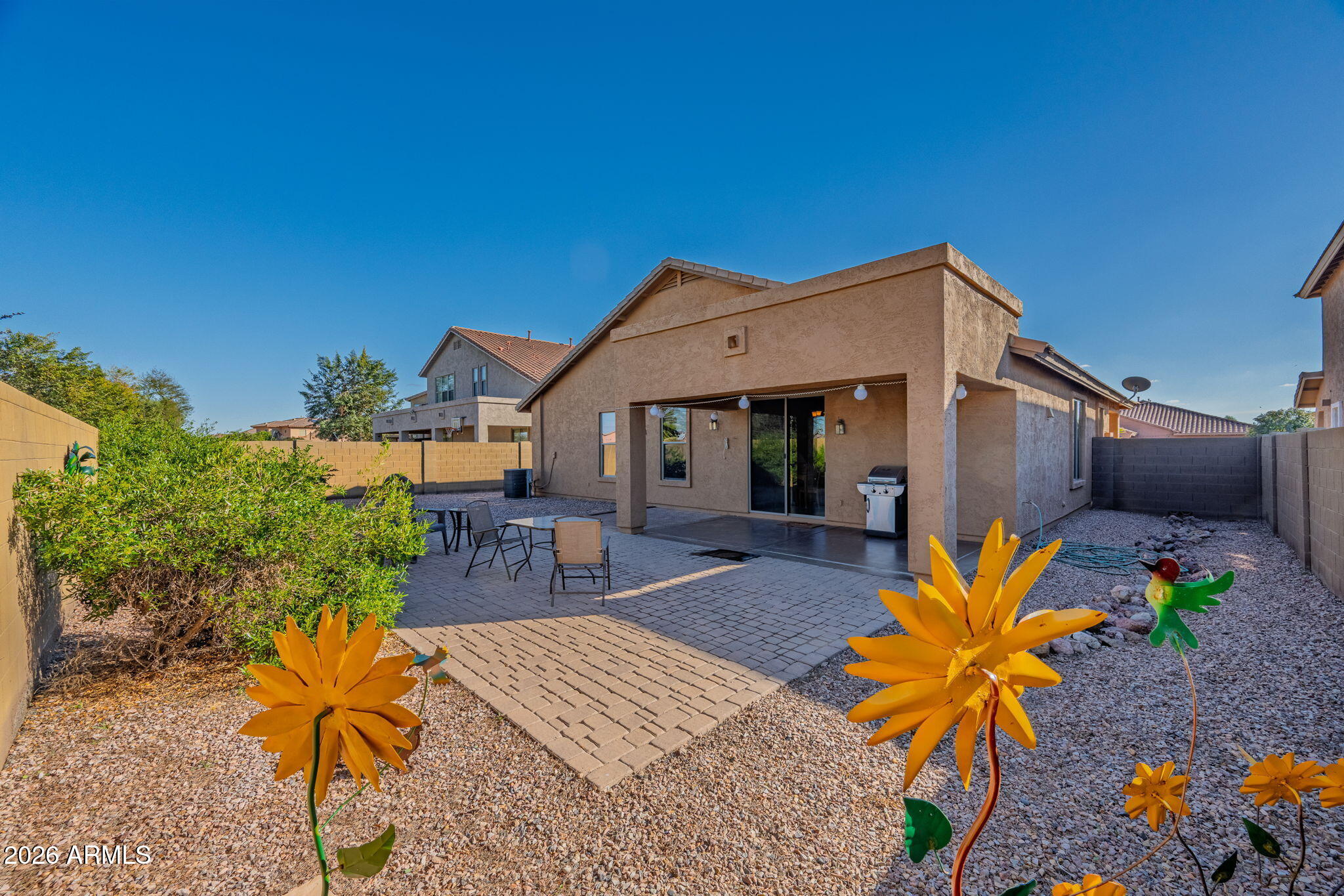 45558 West Mountain View Road Maricopa, AZ 85139 - Photo 27 of 33 a front view of house with outdoor seating