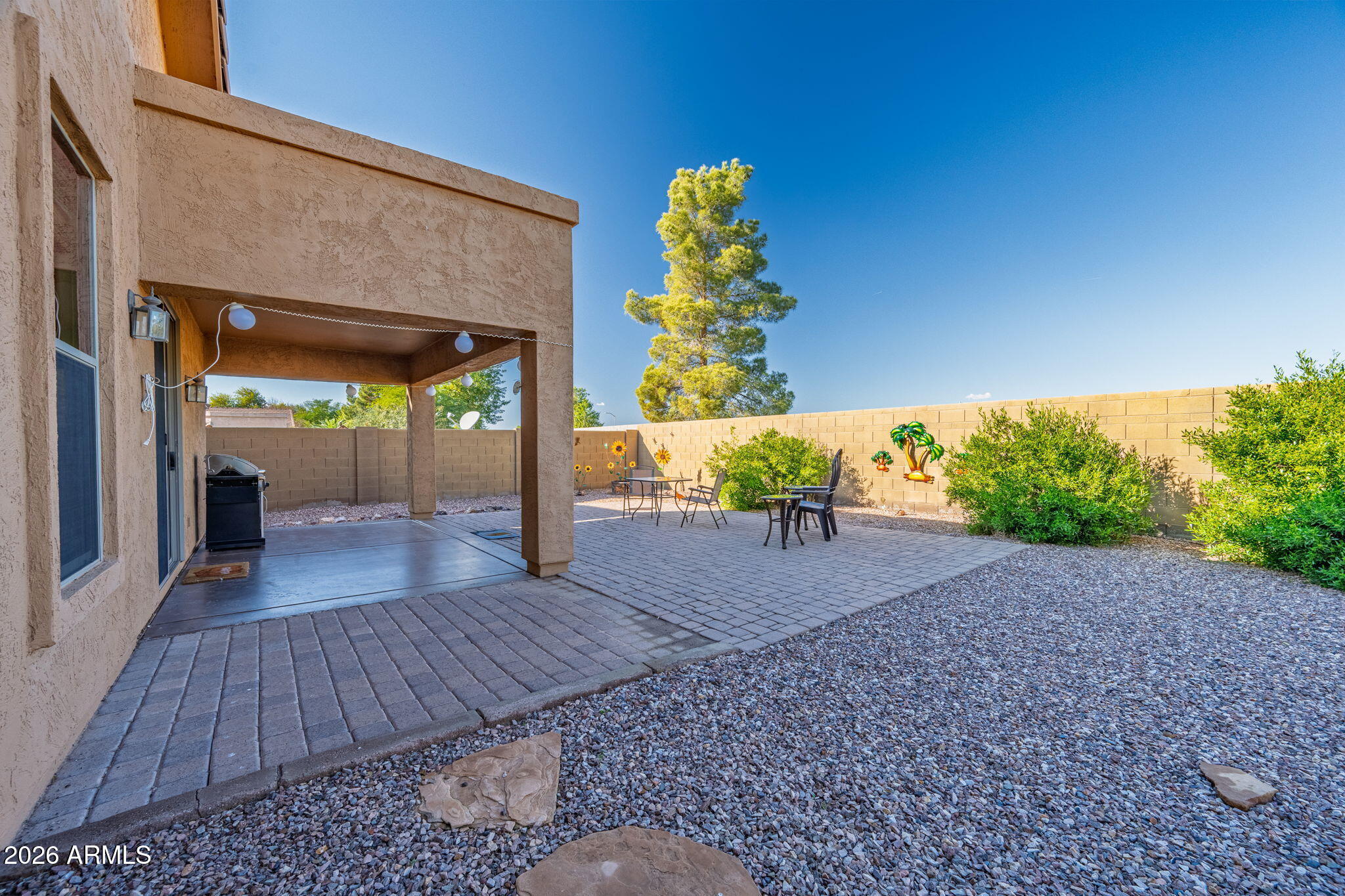 45558 West Mountain View Road Maricopa, AZ 85139 - Photo 29 of 33 a view of a porch with wooden floor and a potted plant