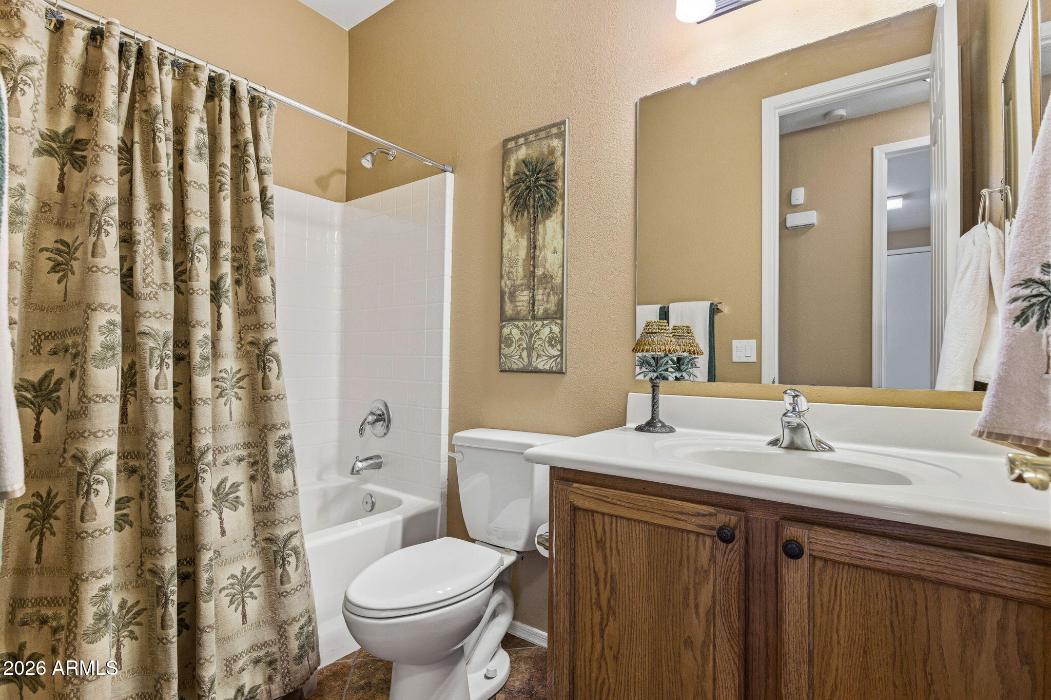 45558 West Mountain View Road Maricopa, AZ 85139 - Photo 10 of 33 a bathroom with a sink toilet and shower