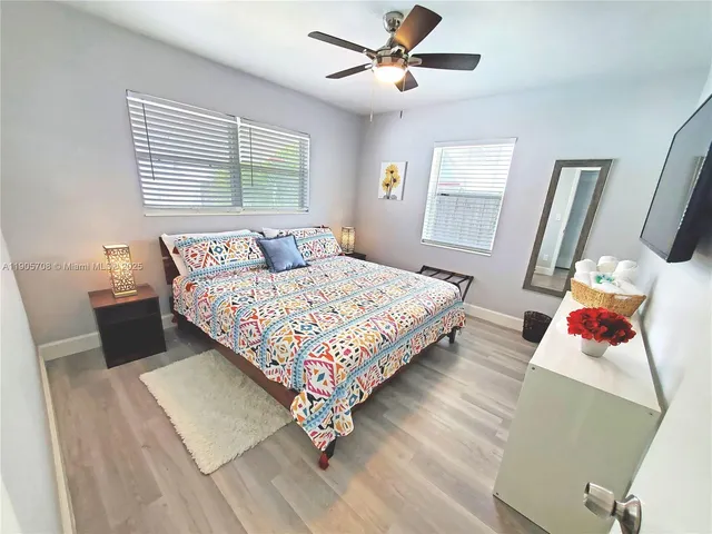 a bedroom with a bed furniture and a window