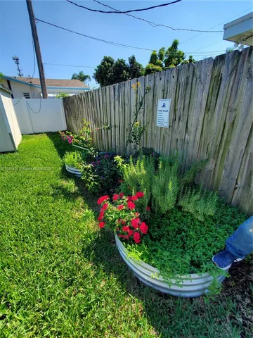 a view of a garden filled with lots of flower plants