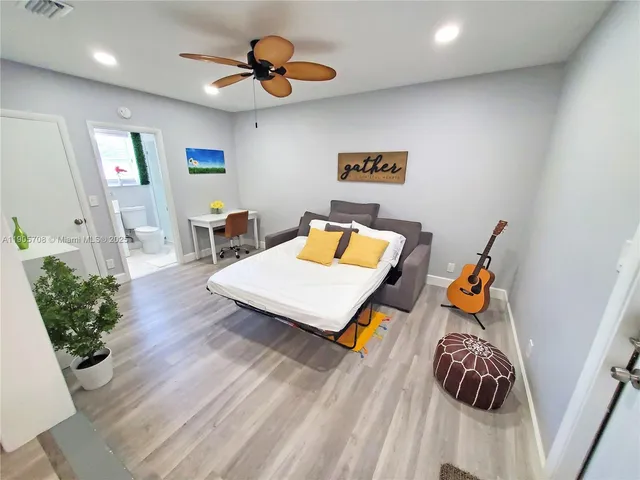 a workspace with furniture and wooden floor