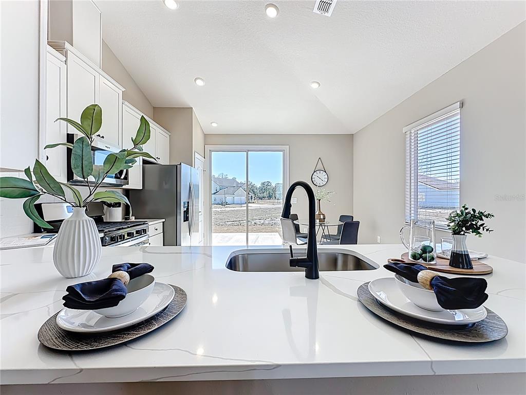 3941 Gareys Ferry Way Middleburg, FL 32068 - Photo 14 of 45 a living room with furniture and a potted plant