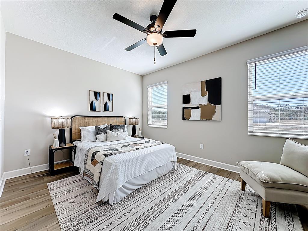 3941 Gareys Ferry Way Middleburg, FL 32068 - Photo 15 of 45 a bedroom with a large bed and a window