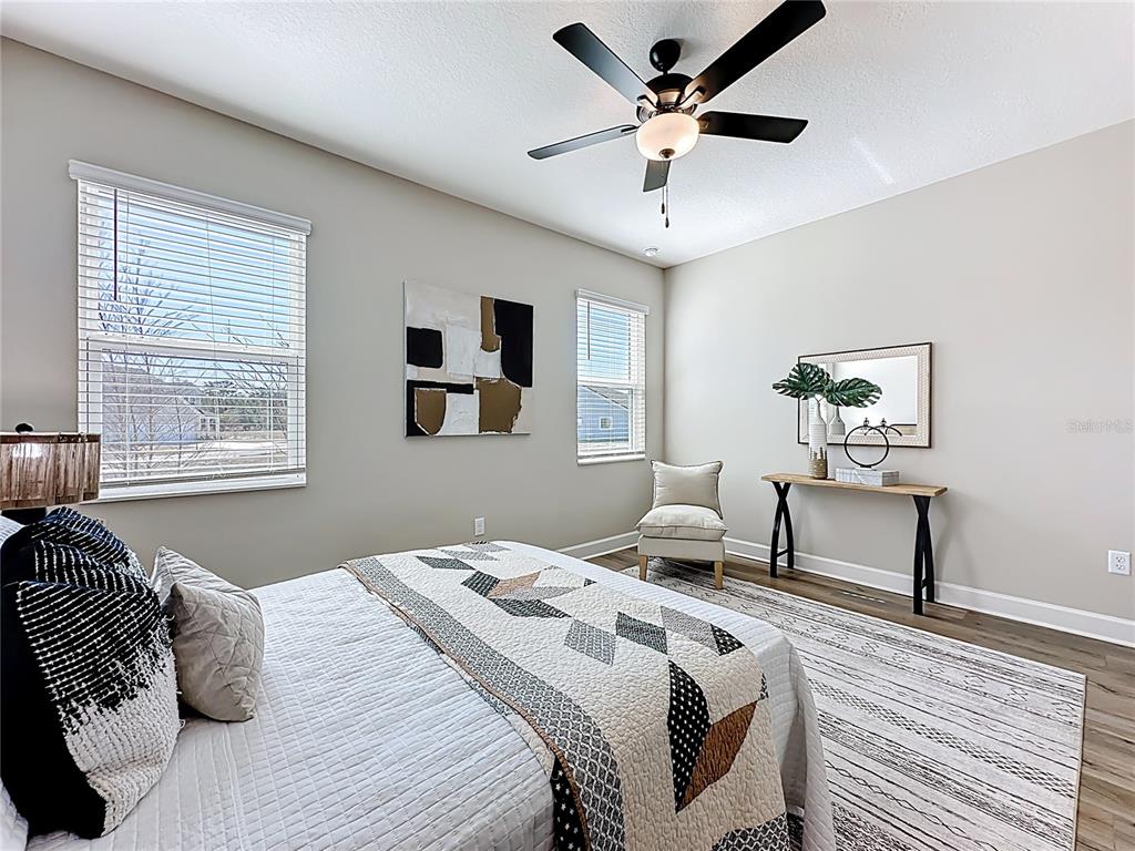 3941 Gareys Ferry Way Middleburg, FL 32068 - Photo 17 of 45 a bedroom with a bed furniture and a window