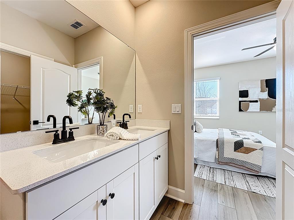 3941 Gareys Ferry Way Middleburg, FL 32068 - Photo 18 of 45 a bathroom with a sink and a mirror