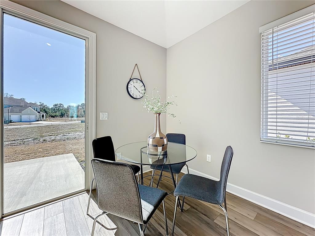 3941 Gareys Ferry Way Middleburg, FL 32068 - Photo 25 of 45 a view of a dining room with a table and chairs