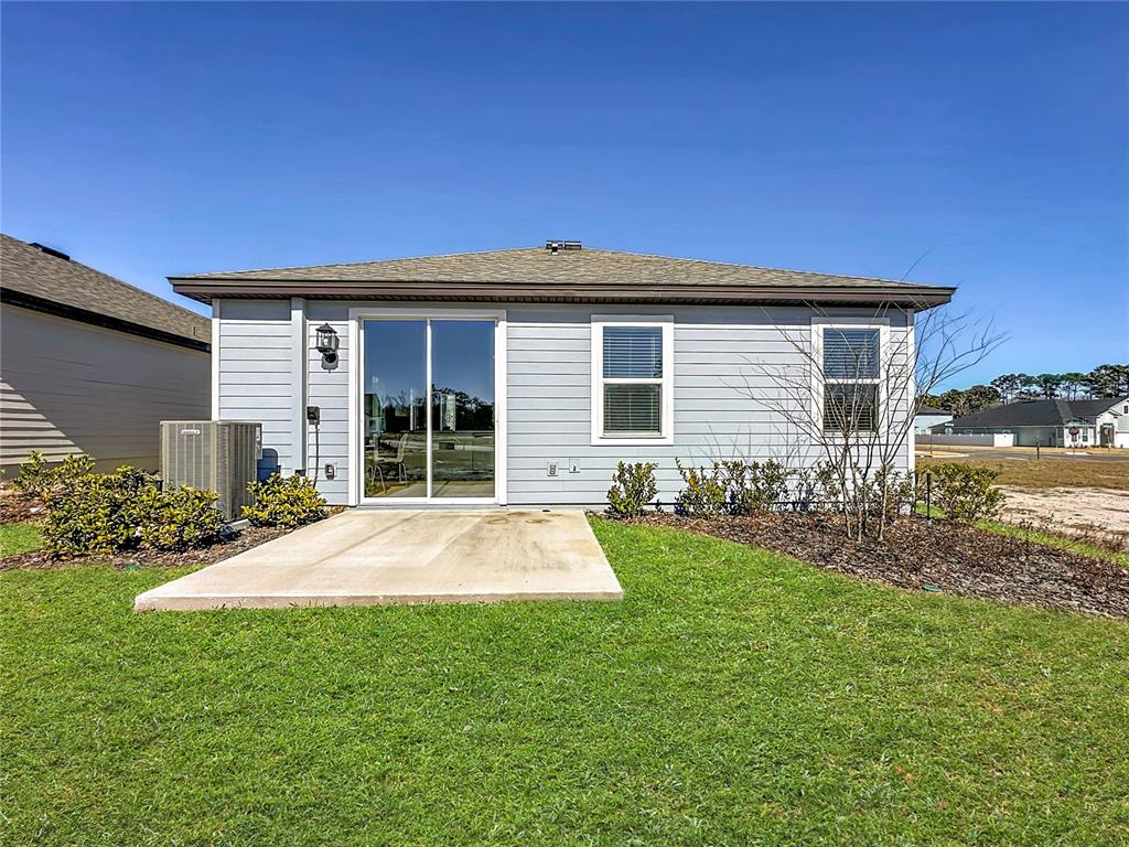 3941 Gareys Ferry Way Middleburg, FL 32068 - Photo 34 of 45 a front view of a house with a garden