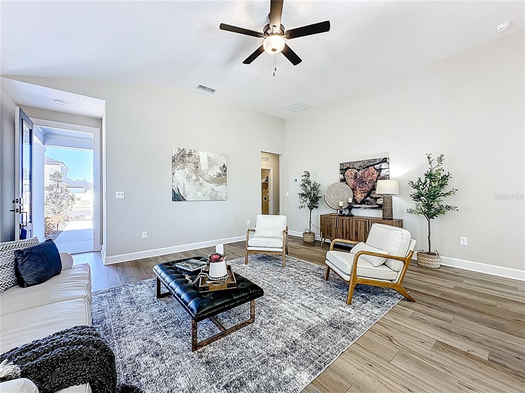3941 Gareys Ferry Way Middleburg, FL 32068 - Photo 4 of 45 a living room with furniture rug and a window