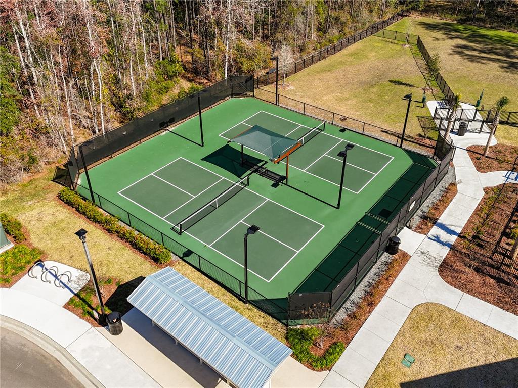 3941 Gareys Ferry Way Middleburg, FL 32068 - Photo 45 of 45 a green field with lots of trees in the background