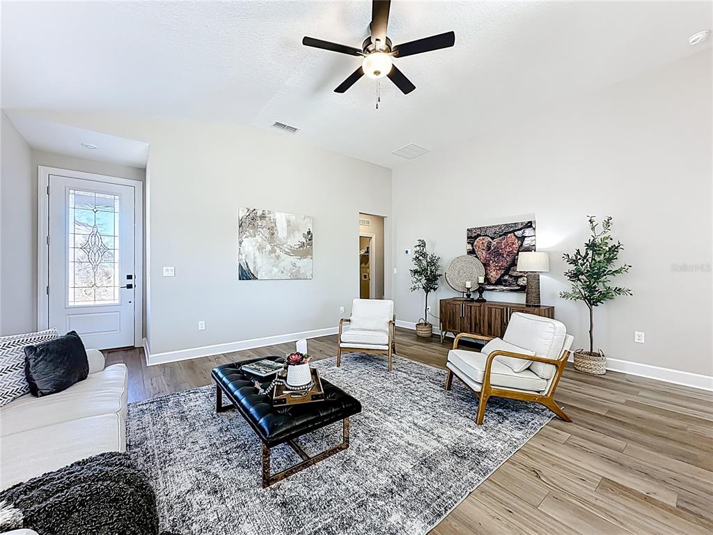 3941 Gareys Ferry Way Middleburg, FL 32068 - Photo 5 of 45 a living room with furniture and a rug