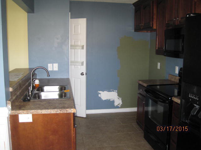435 Bob White Road Macon, GA 31216 - Photo 8 of 14 a kitchen with granite countertop a stove and a sink