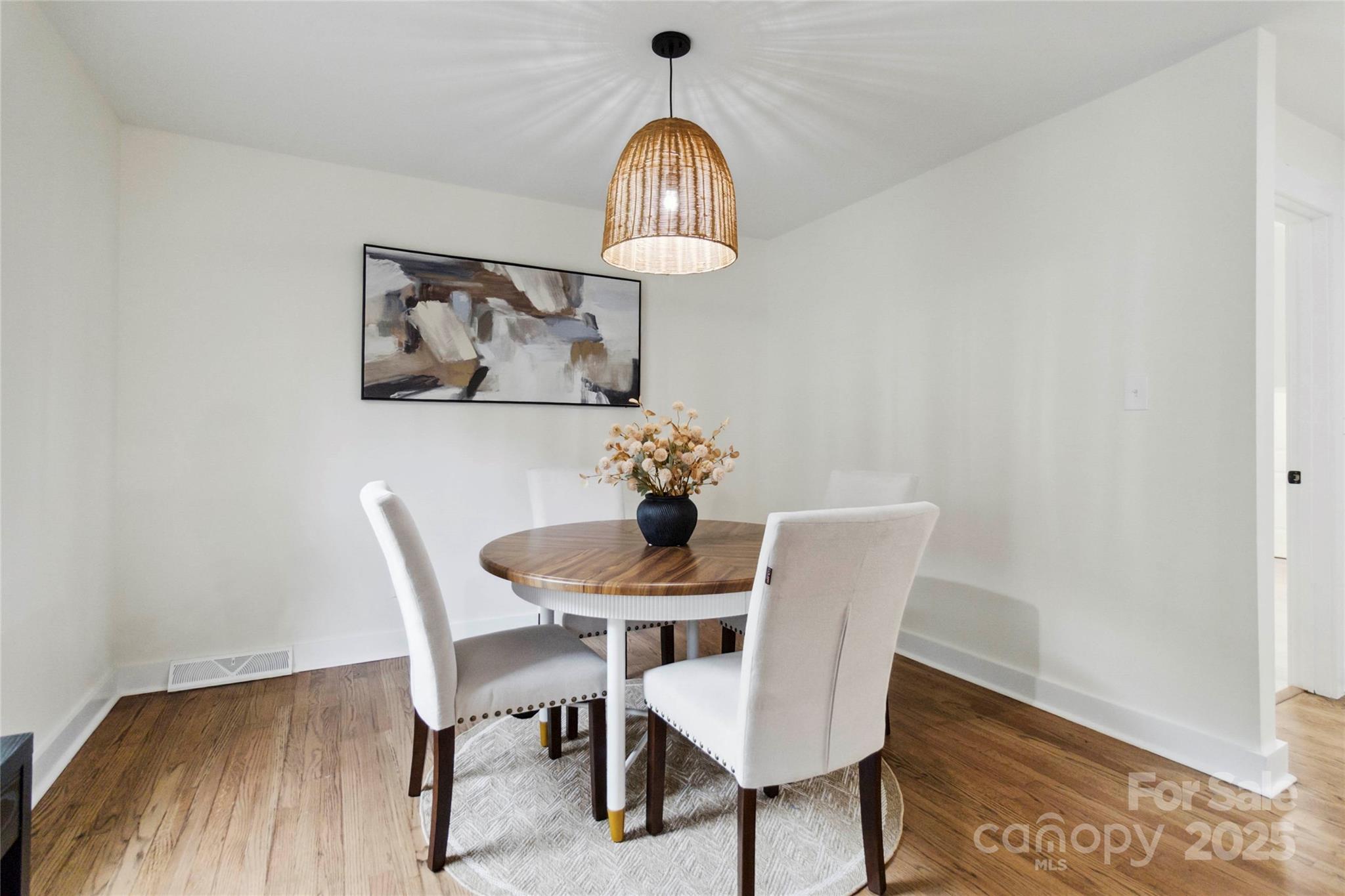 3801 Rea Road Charlotte, NC 28226 - Photo 11 of 47 a view of a dining room with furniture and wooden floor