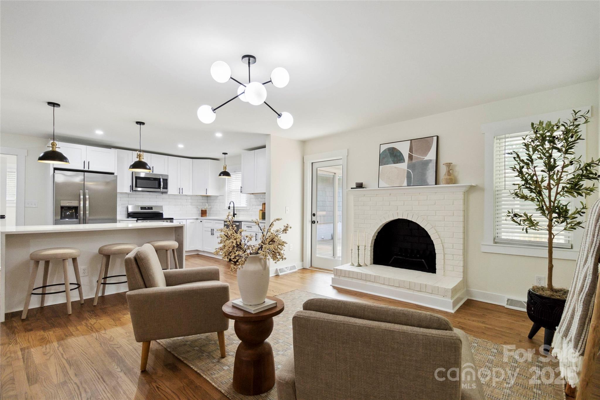 3801 Rea Road Charlotte, NC 28226 - Photo 19 of 47 a living room with furniture and a fireplace