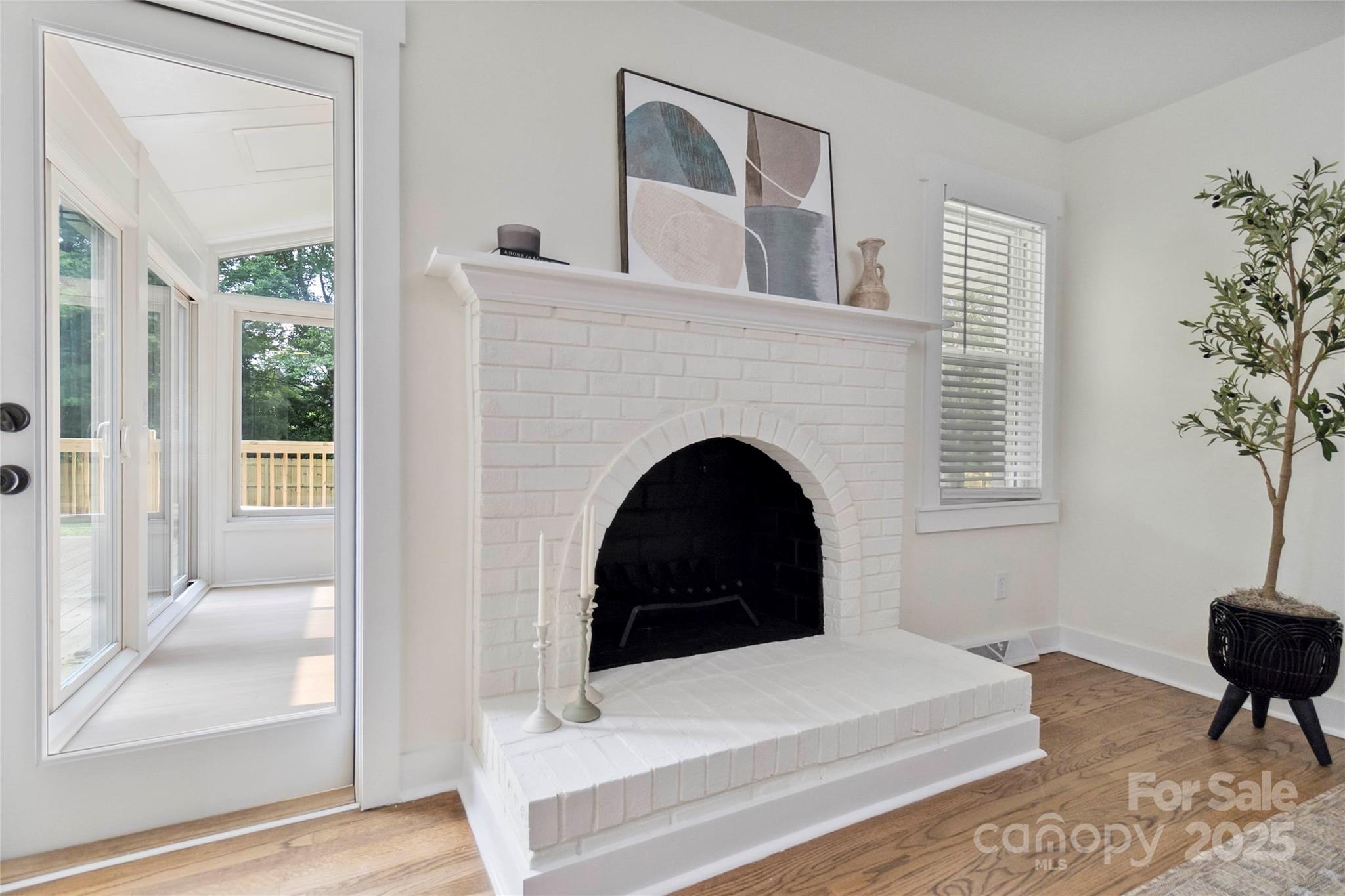 3801 Rea Road Charlotte, NC 28226 - Photo 20 of 47 a living room with a fireplace and a potted plant