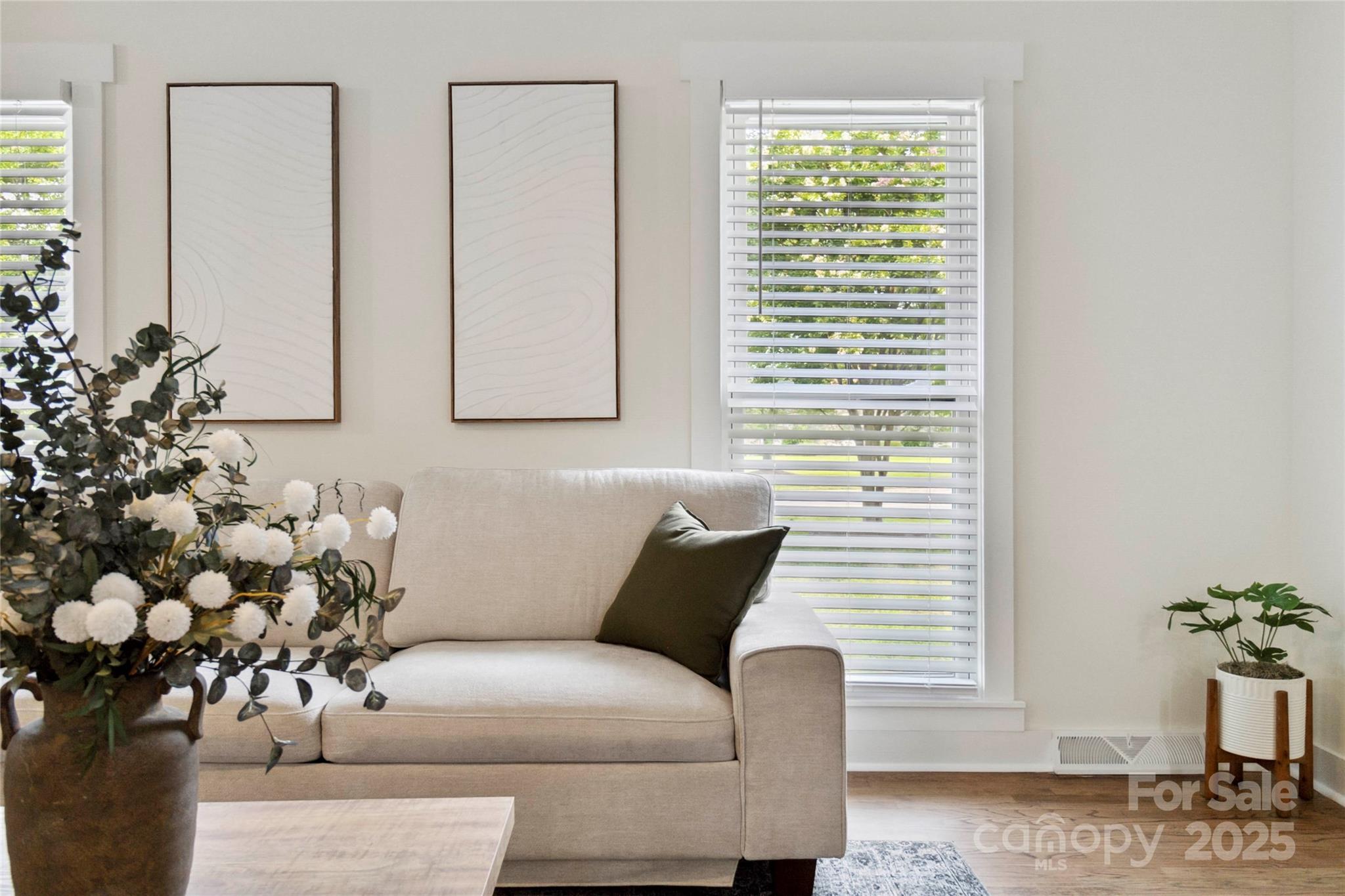 3801 Rea Road Charlotte, NC 28226 - Photo 23 of 47 a living room with furniture and flowers