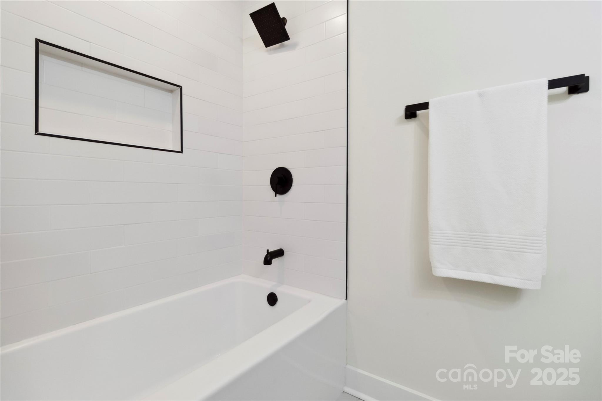 3801 Rea Road Charlotte, NC 28226 - Photo 26 of 47 a bathroom with a bathtub and a shower