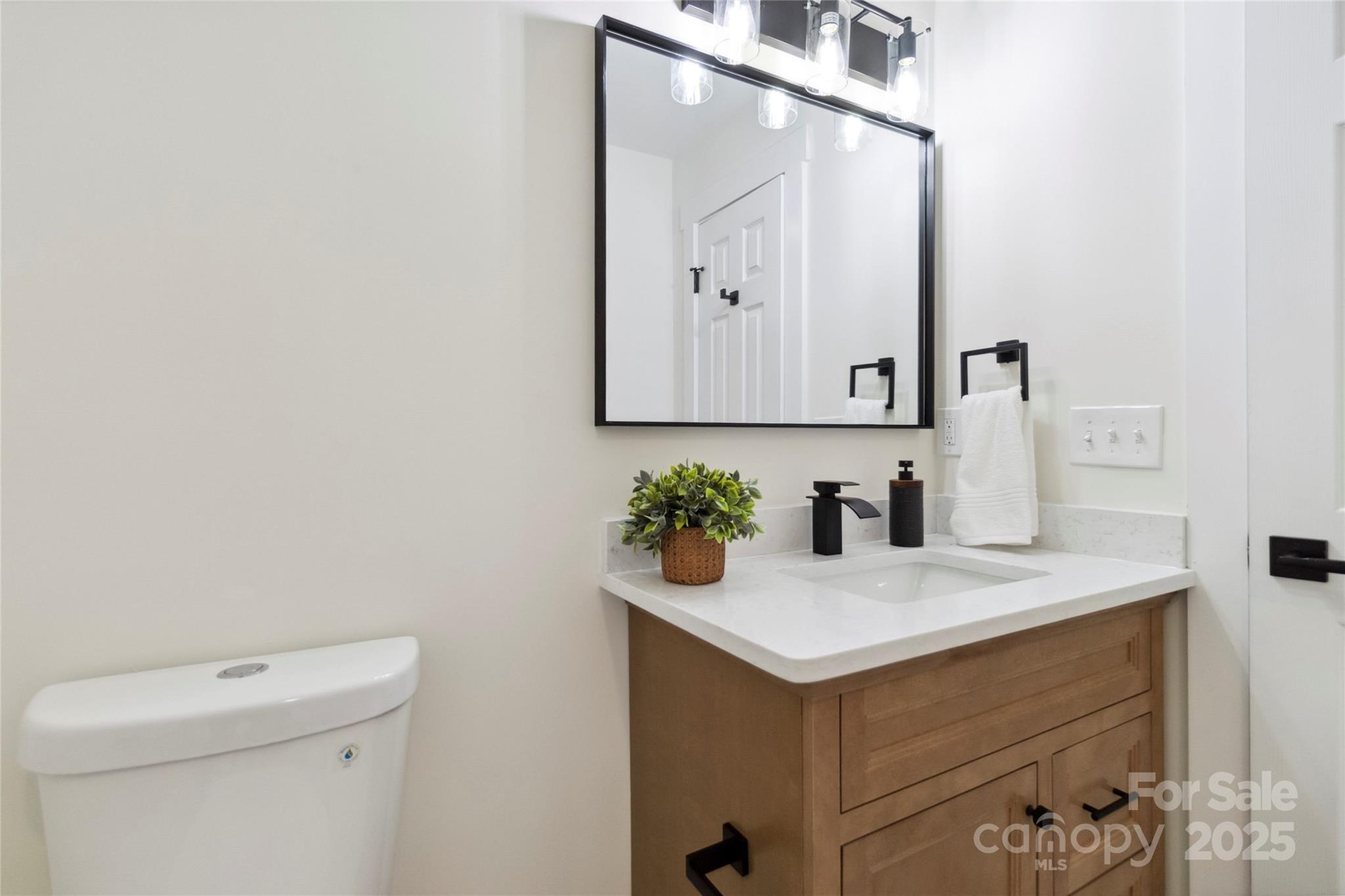 3801 Rea Road Charlotte, NC 28226 - Photo 27 of 47 a bathroom with a sink vanity and toilet