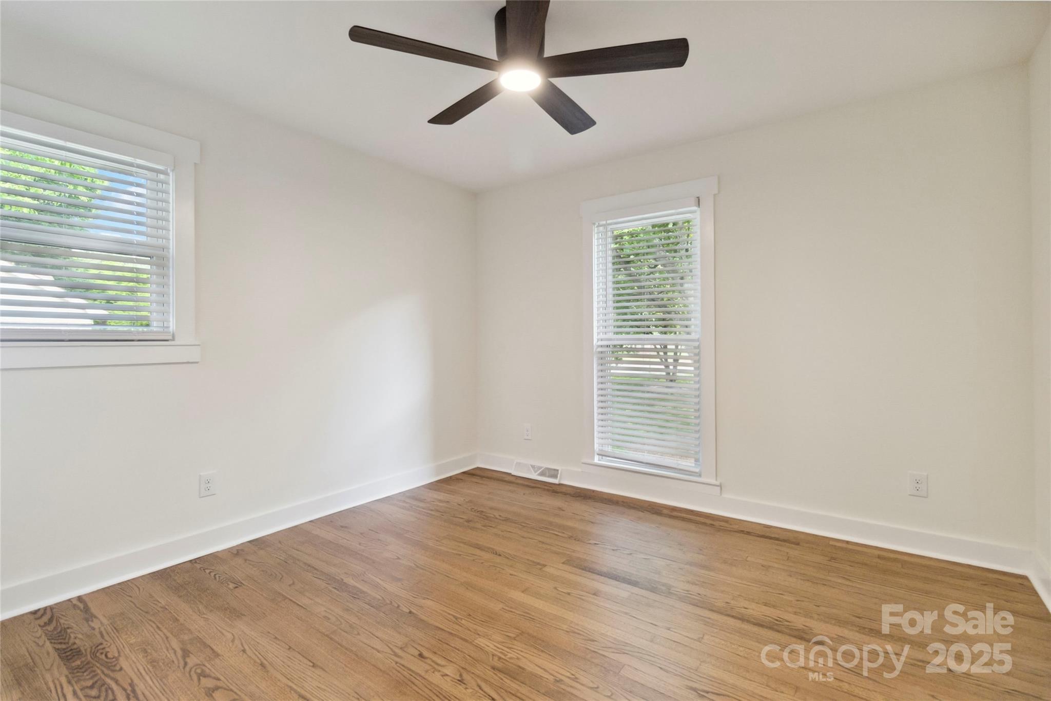 3801 Rea Road Charlotte, NC 28226 - Photo 28 of 47 a view of empty room with wooden floor and fan