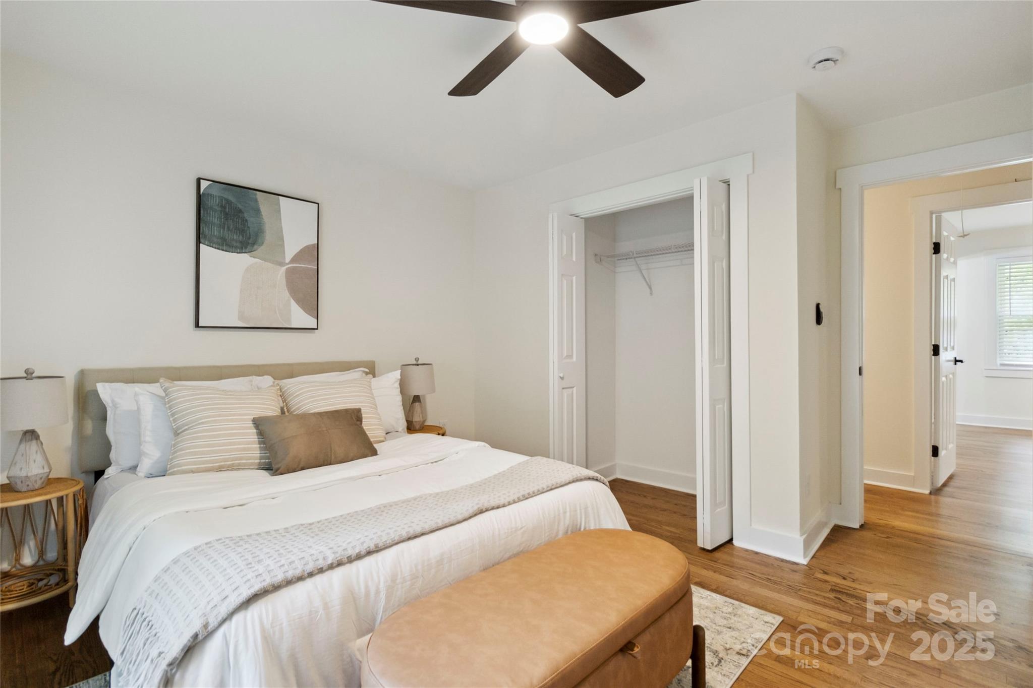 3801 Rea Road Charlotte, NC 28226 - Photo 31 of 47 a bedroom with a bed and a painting on the wall
