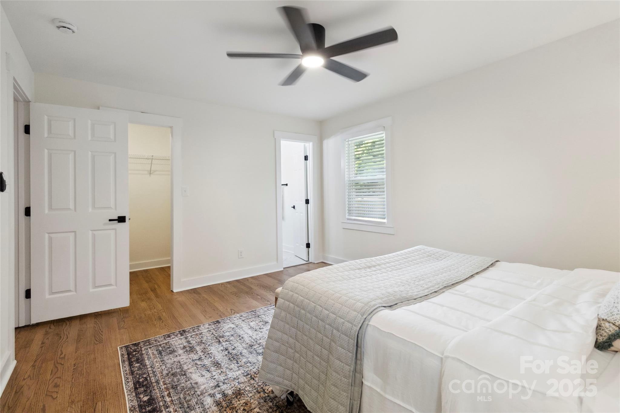 3801 Rea Road Charlotte, NC 28226 - Photo 33 of 47 a bedroom with a bed and a ceiling fan