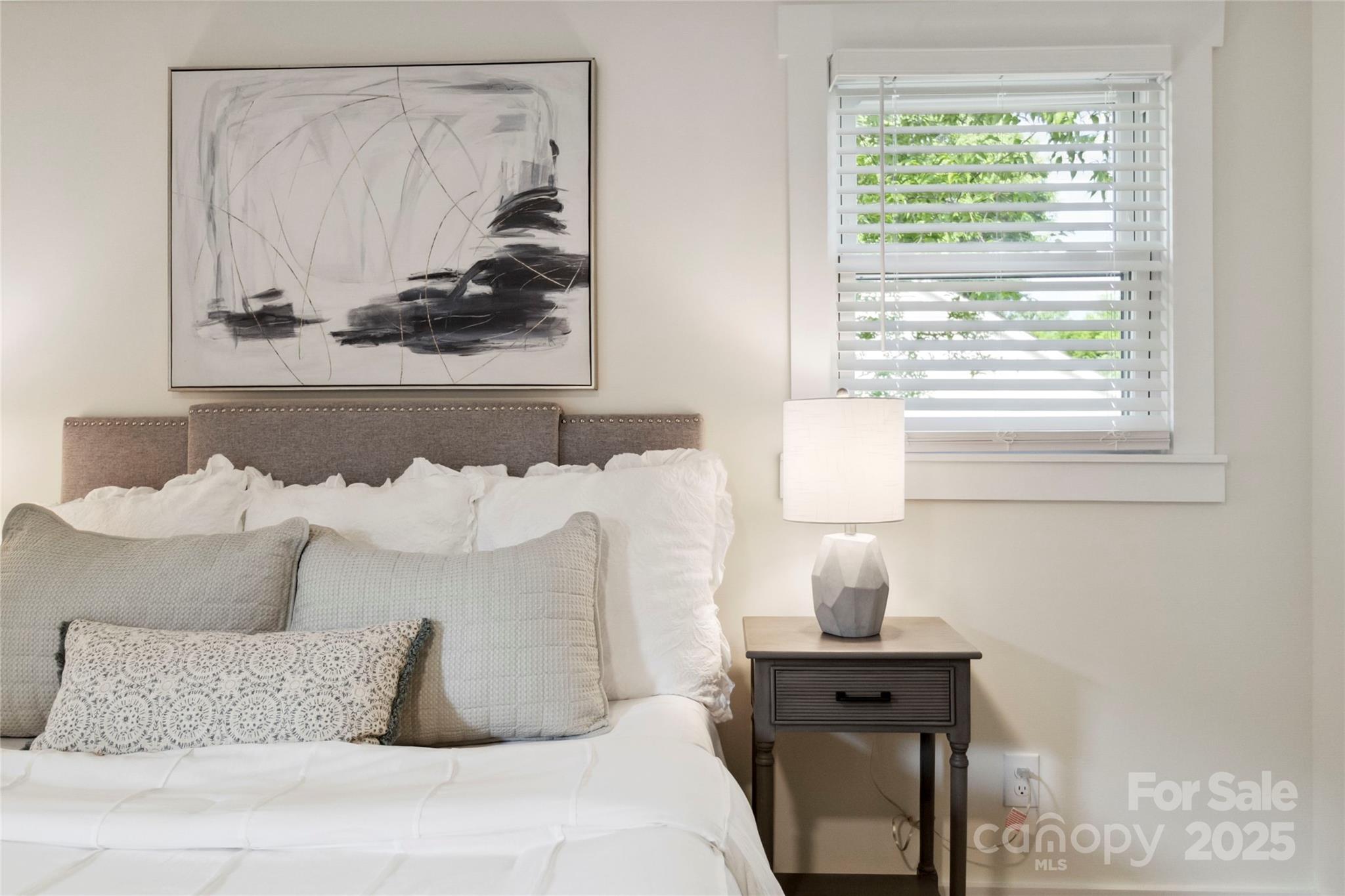 3801 Rea Road Charlotte, NC 28226 - Photo 34 of 47 a bed sitting in a bedroom next to a window