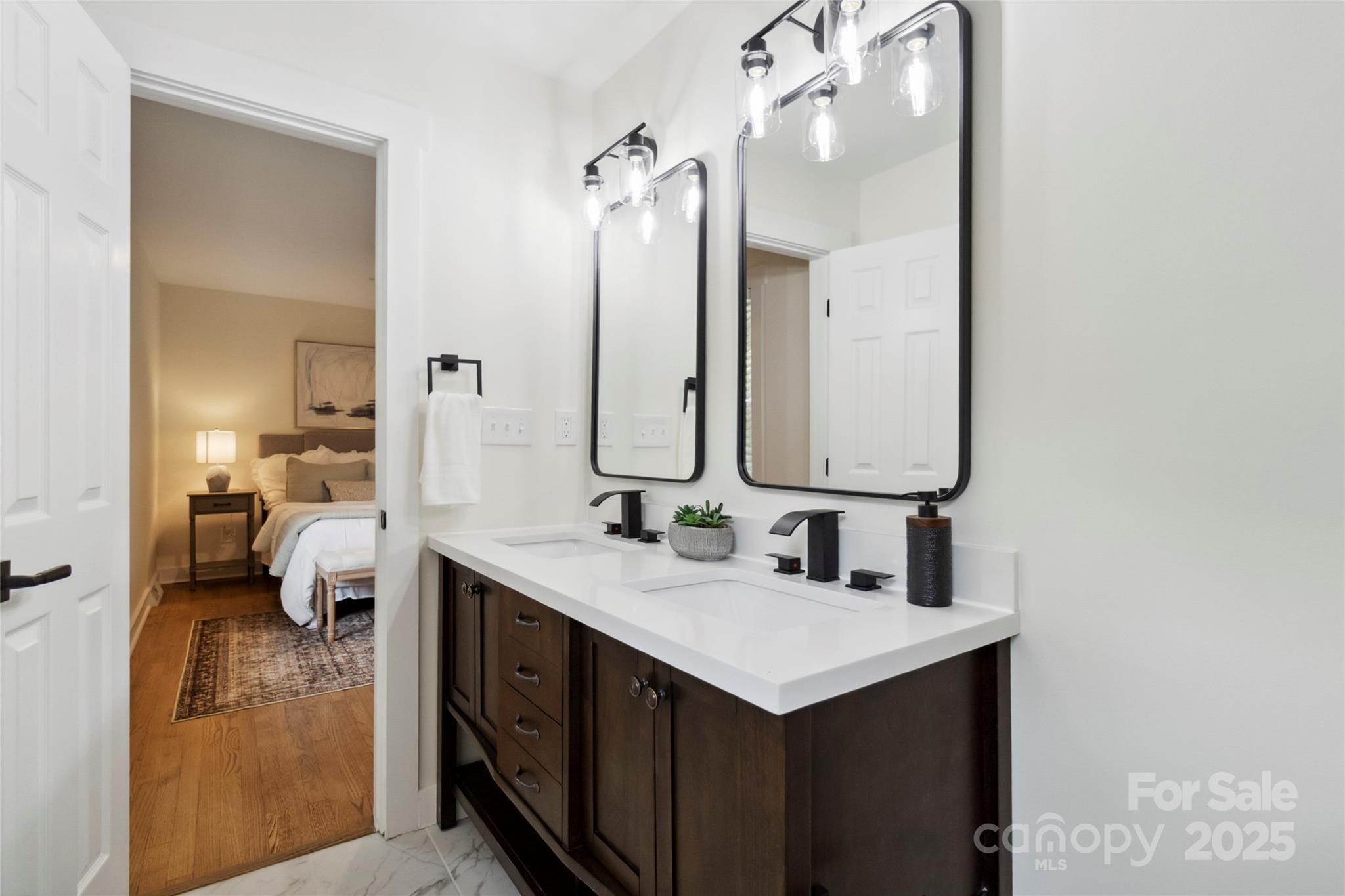 3801 Rea Road Charlotte, NC 28226 - Photo 36 of 47 a en suite bathroom with a double vanity sink and mirror