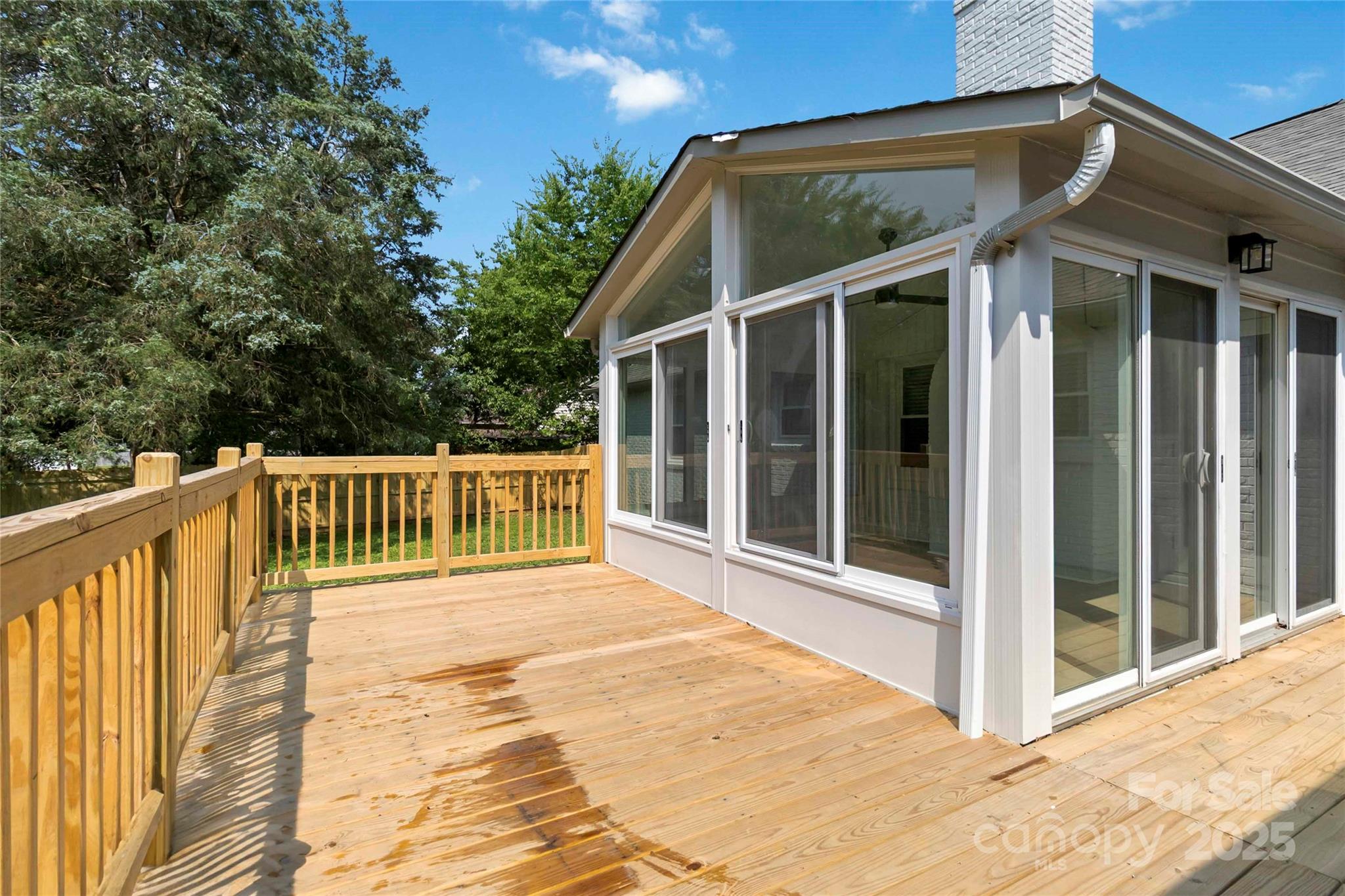 3801 Rea Road Charlotte, NC 28226 - Photo 43 of 47 a view of backyard with large trees and wooden fence